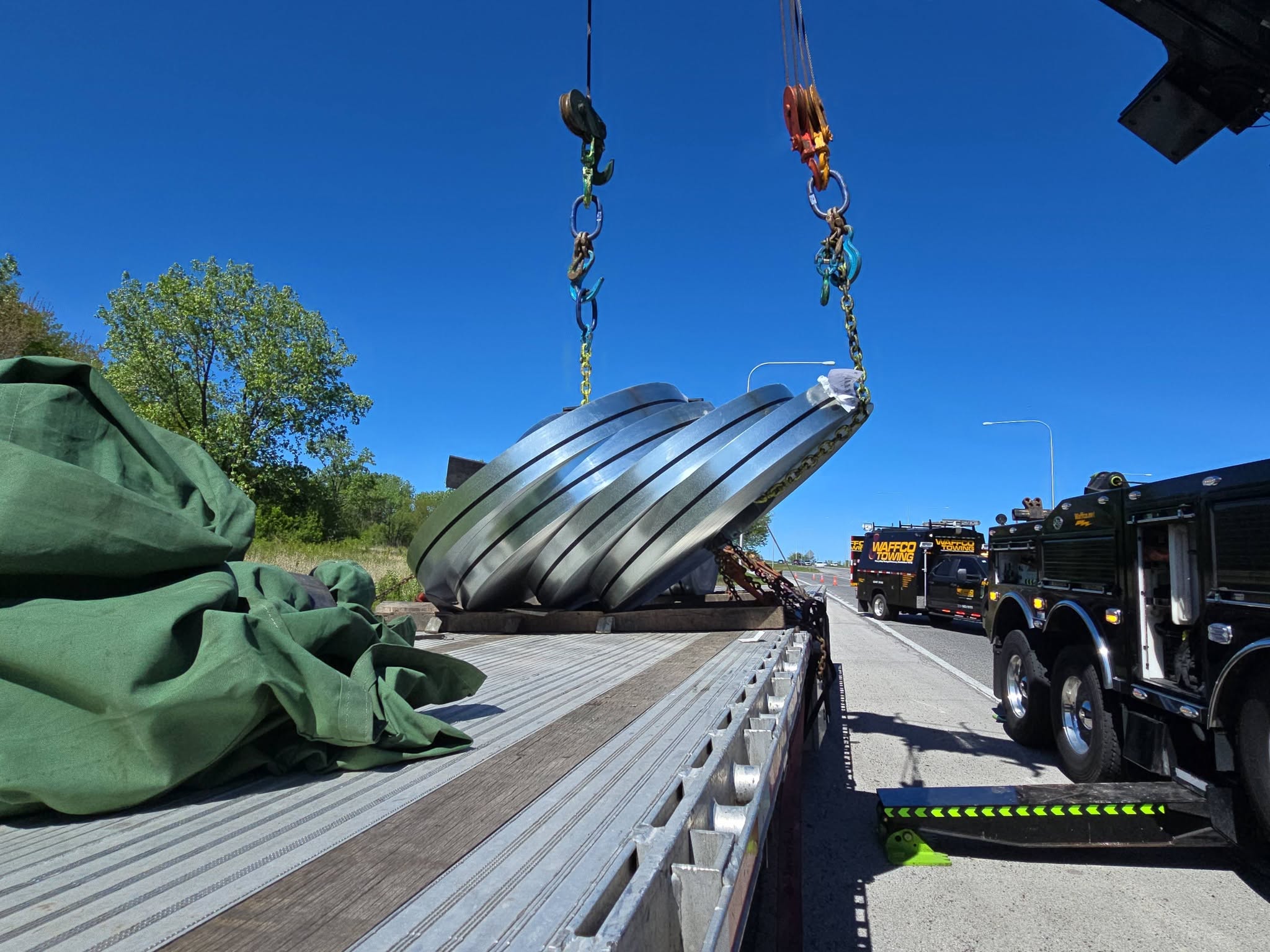 Waffco recovery equipment lifting a specialized metal load